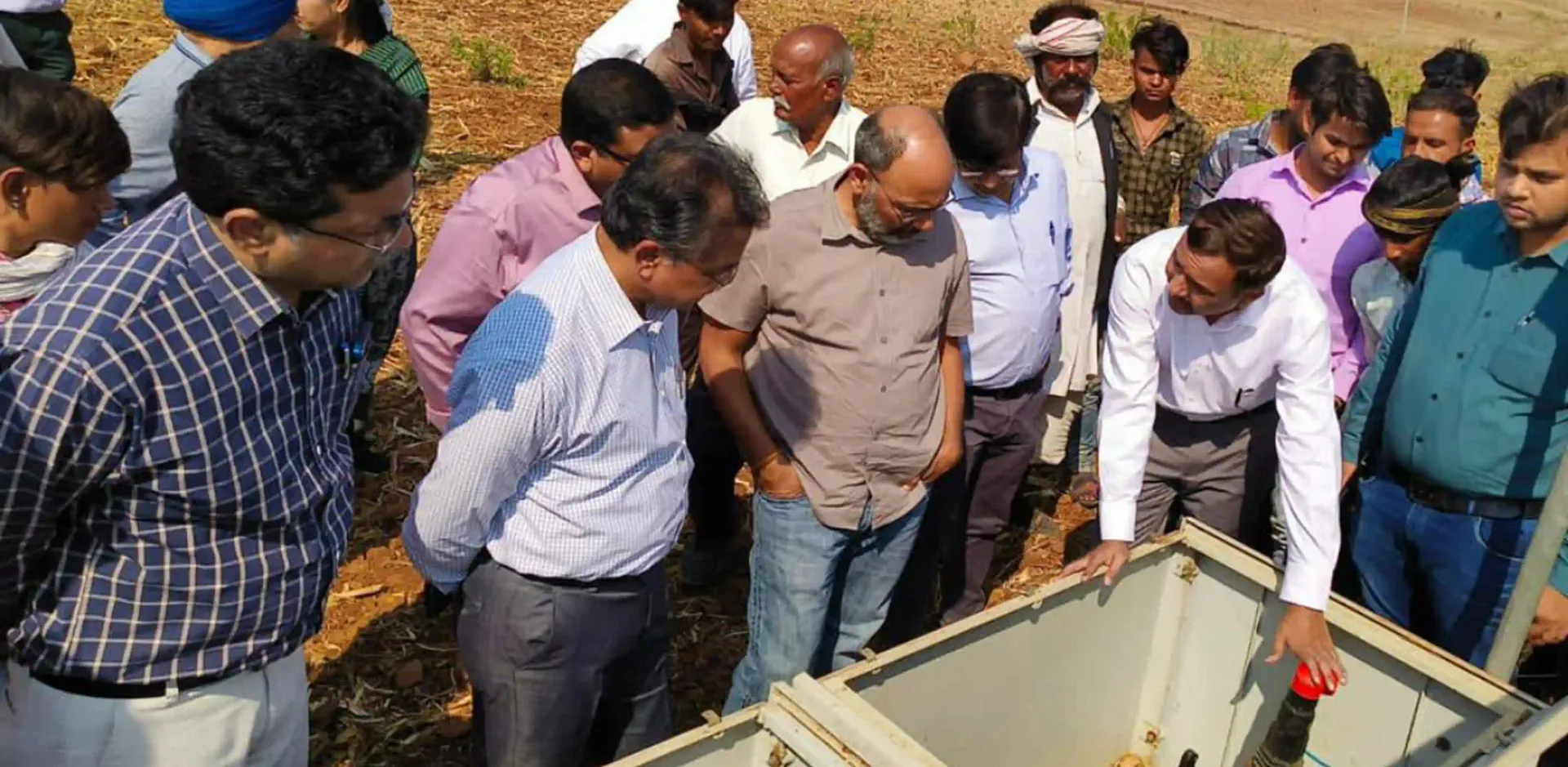 Madhya Pradesh IAS officers inspecting field irrigation equipment